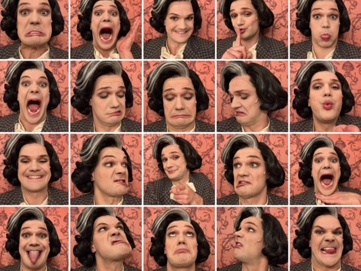 In ganz vielen Bilder-Kacheln ist das Gesicht von Schauspieler Matti Kraus vor einem rosafarbenen Hintergrund zu sehen. Er macht verschiedene Grimassen und Gesichtsausdrücke und trägt das Kostüm von "Tante Esther": Eine schwarze schulterlange Perücke mit grauen Strähnen und einen grauen Blazer.